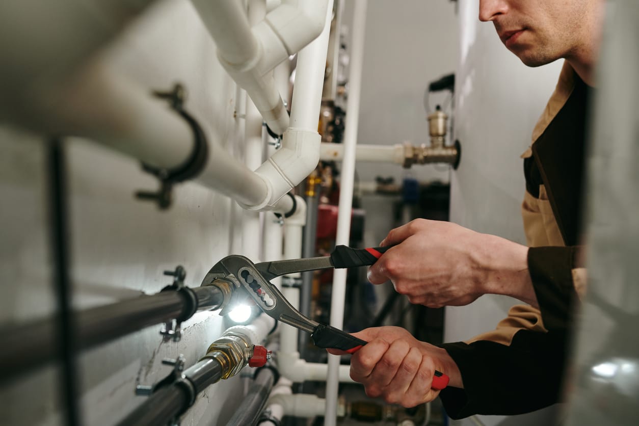 Plumbers maintaining commercial plumbing pipes in Jacksonville