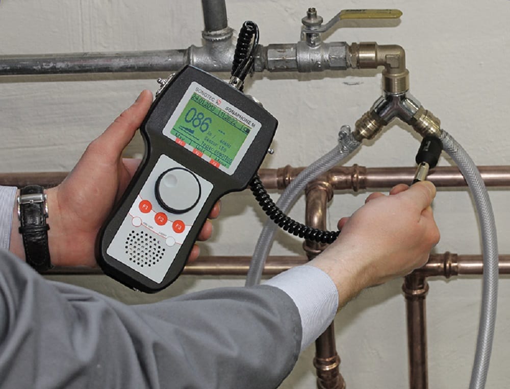 Plumber testing pipes with electronic leak detection equipment in Jacksonville
