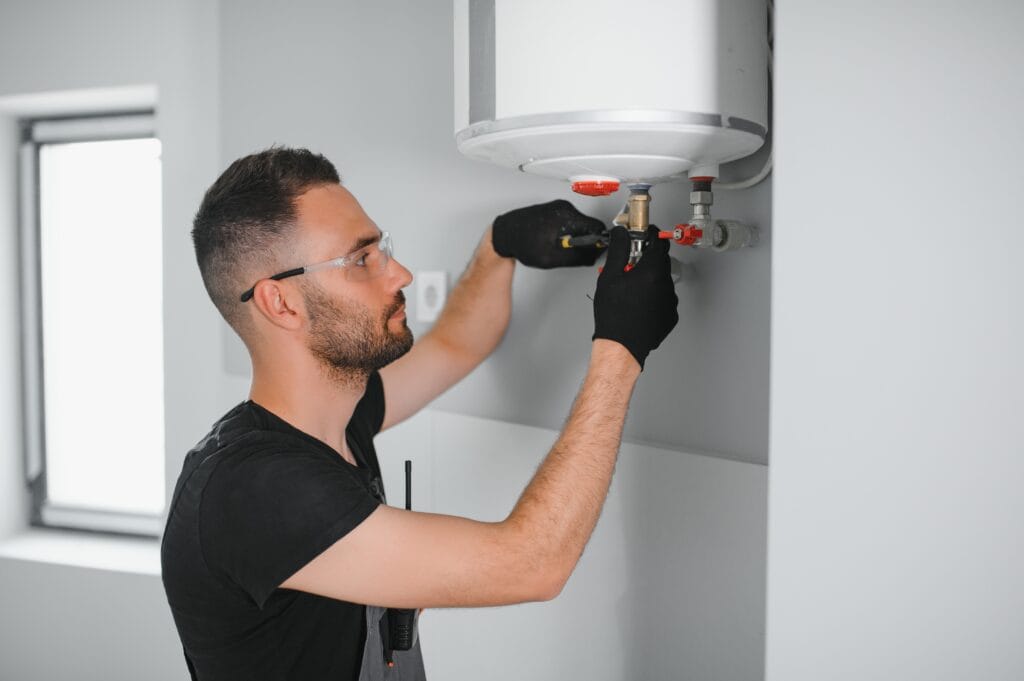 Technician performing water heater maintenance in Jacksonville